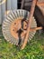 Old rusty metal and rubber wheel of hand-barrow