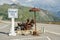 Old rusty metal sculpture representing couple of riders on motorbike on top of Grimselpass