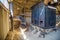 Old rusty oven inside the elevator of an abandoned lime plant