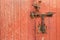Old rusty padlock on wooden door. Home security