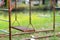 Old rusty playground swing in the park