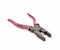 Old and rusty pliers with pink aged handlers