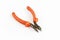 Old rusty pliers tools, metal cutting pliers with orange handle