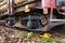 Old rusty rails and wheels of a railway carriage loaded with timber