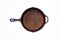 Old rusty round cast iron frying pan