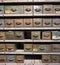 Old rusty shelf with many drawers and boxes for in a disused workshop