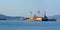 Old rusty ships side by side. Shipwrecks in Greece.