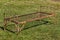 Old rusty spring bed on green grass