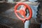 Old rusty steampunk electro valve wheel painted red paint swellings peeling selective focus with handle grip over out of