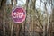 Old rusty stop sign among trees in radioactive zone in the Duga radar area near the Pripyat city. Chernobyl Exclusion Zone,