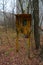 Old rusty telephone booth on overgrown tree street of abandoned ghost town of Pripyat, Chernobyl exclusion zone, Ukraine
