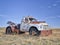 Old rusty towing truck on a prairie