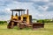 Old rusty tractor in field