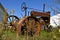 Old rusty tractor parked in the weed