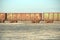 Old rusty train cars with stalactites of salt