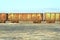 Old rusty train cars with stalactites of salt