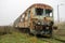 Old rusty trains. Old abandoned track, siding with dirty old trains.