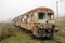 Old rusty trains. Old abandoned track, siding with dirty old trains.