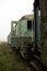 Old rusty trains. Old abandoned track, siding with dirty old trains.