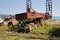 Old rusty trolley on overgrown rails at abandoned port