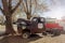 Old rusty truck under a tree