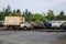 Old rusty trucks at abandoned industrial area. Rusty trucks junkyard