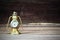 Old rusty vintage classic table golden clock on blurred wooden background