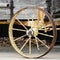 Old Rusty Wagon Wheel on Wooden Wagon