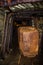 Old rusty wagons in abandoned mine tunnel with wooden timbering