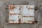 Old, rusty and weathered metal window coverings, closed shut