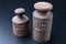 Old rusty weights on a dark table. Accessories for weighing products