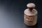 Old rusty weights on a dark table. Accessories for weighing products