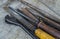 Old rusty working iron tools on textured fabric close-up