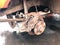 Old rusty worn brake discs, pads of a truck, car. Car suspension repair. Replacing wheel