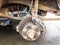 Old rusty worn brake discs, pads of a truck, car. Car suspension repair. Replacing wheel