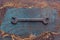 Old rusty wrench over battered metal table rough style. Wrenches top view for construction, industrial, electrician concept design