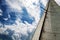 Old sail against the blue sky with clouds