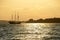 Old sail ship drifts to port seen as a silhouette in backlight