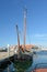 Old sailing boat anchored at dock at Oudeschild harbor on island Texel