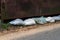 Old sandbags stacked in front of the gate to protect against flooding