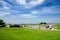 Old Saram With Green Grass And Blue Sky