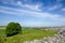 Old Saram With Green Grass And Blue Sky