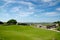 Old Saram With Green Grass And Blue Sky