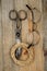 Old scissors, glasses and hank of packthread over wooden texture