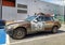 Old scrap rusty veteran car BMW hatchback parked