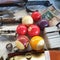 Old scratched billiard balls, knives, silver rings, Turkish banknotes and slides on a showcase in sunday flea market