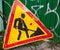 Old scratched metal roadworks sign