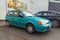 Old sea green compact car Suzuki Swift GLS parked