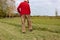 old senior farmer raking lawn