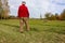 old senior farmer raking lawn